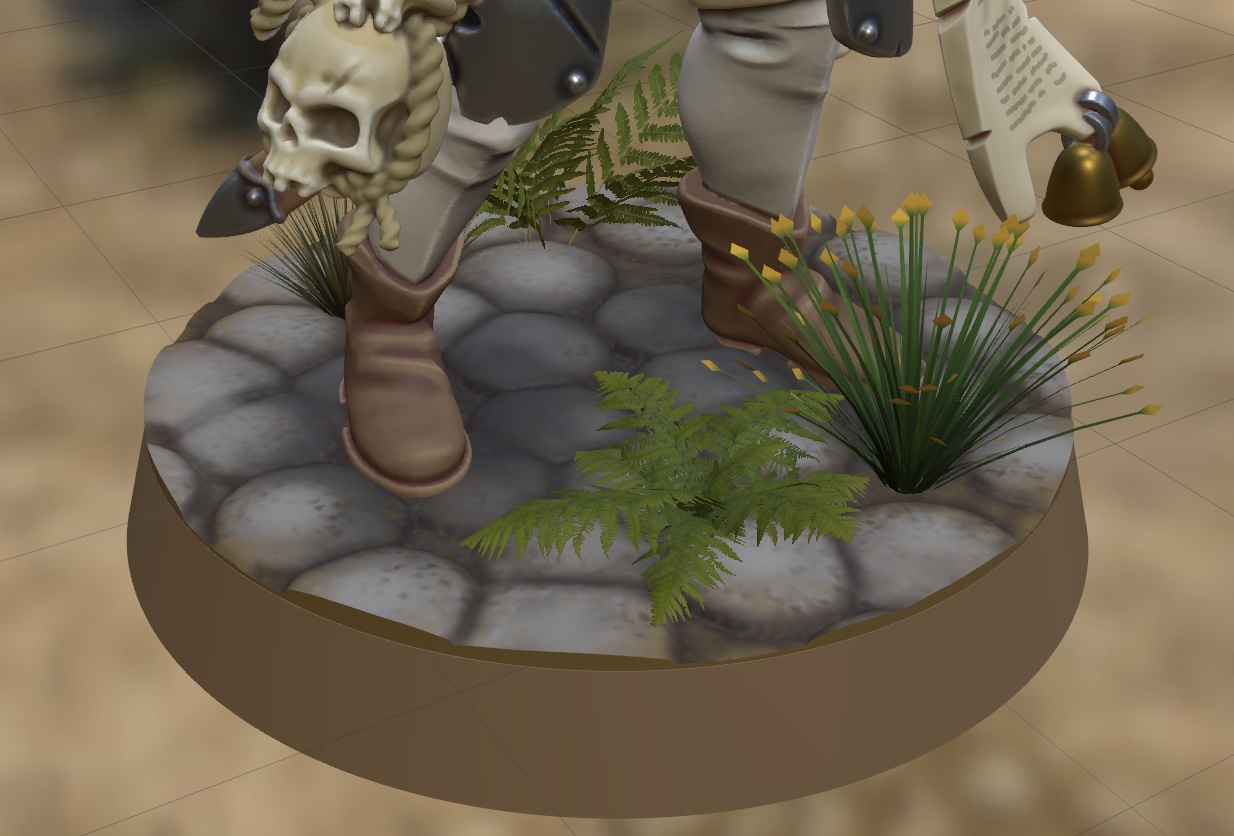 A miniature's stone cobble base dressed with ferns, tufts and flowering grasses in MyMiniStudio's base mode
